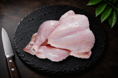 Cleaned whole chicken with skin attached